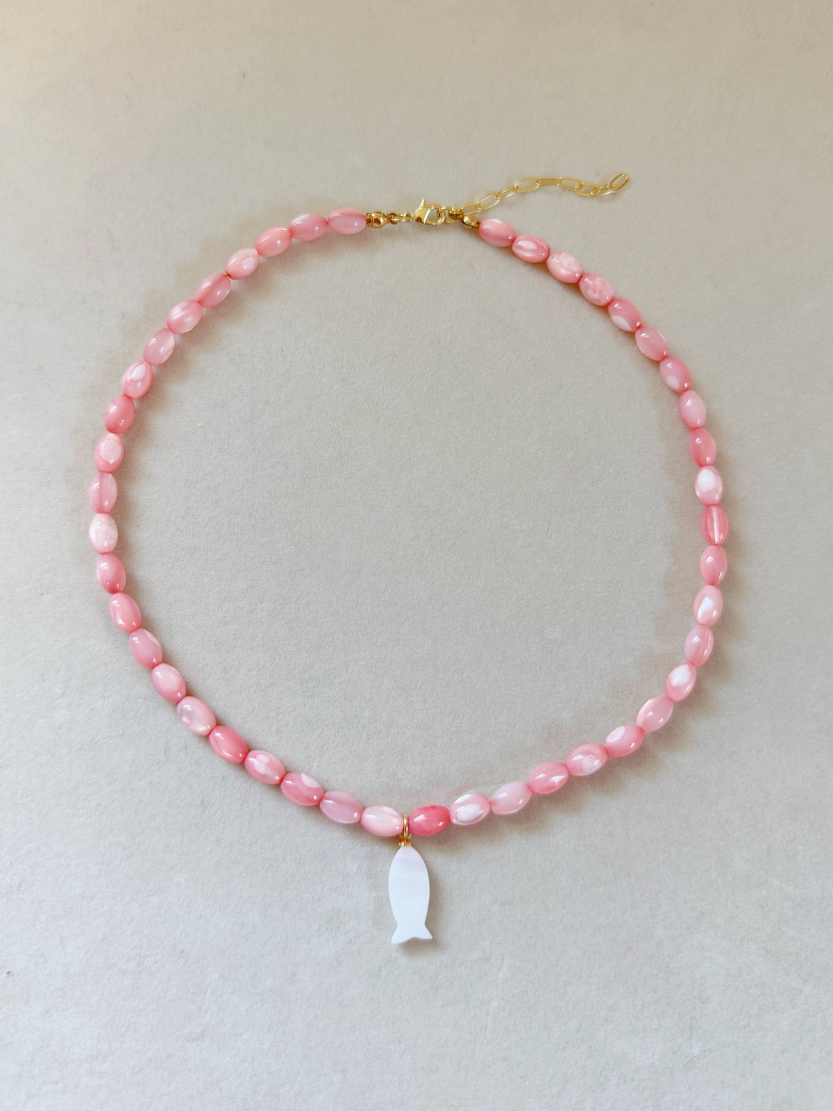pink shell fish necklace