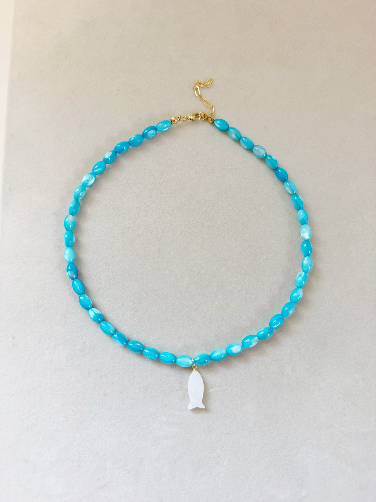 blue shell fish necklace