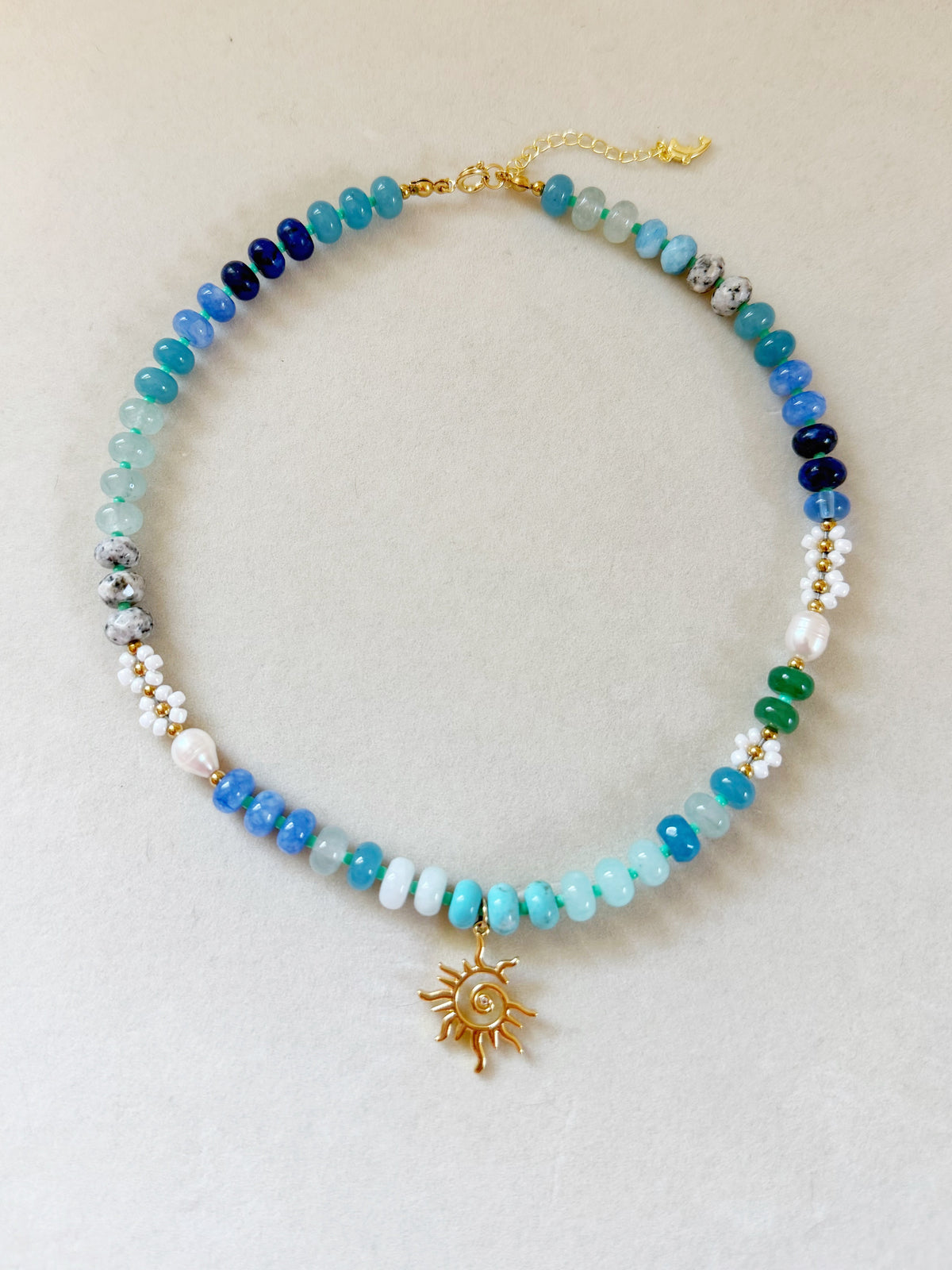 multi blue sun necklace